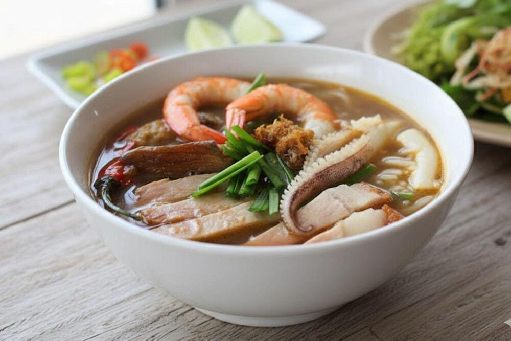 A delicious bowl of bun mam with its irresistible flavors is an unforgettable experience when visiting the floating market in Vietnam